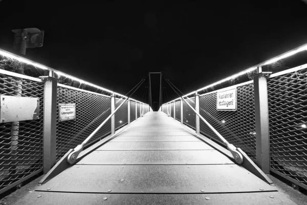 Grayscale Shot Illuminated Pedestrian Bridge Metal Handrails Black Sky — Photo