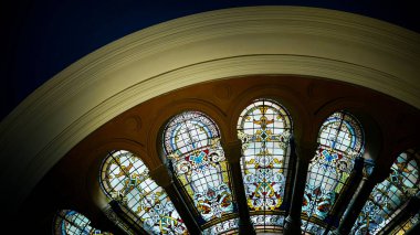 A beautiful shot of decorated arch Stained Glass Wallpapers with blue wall