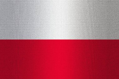 A flag of Poland on stone wall background.