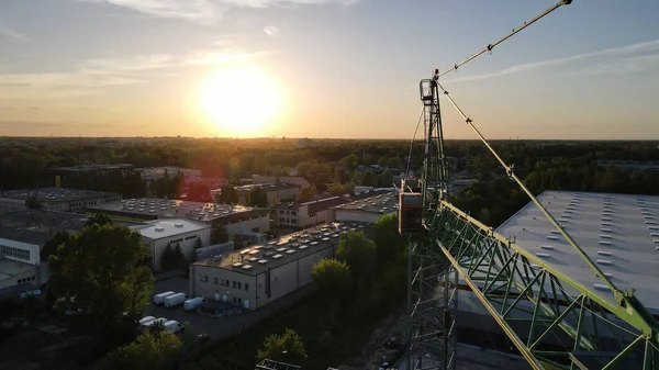 An aerial view around a crane in Warsaw's suburbs in HD
