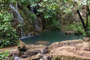 Waterfall at laguna brava in huehuetenango guatemala with little green pond.