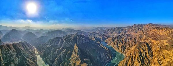 An aerial view of mountains and rivers in Pearl Lake, China