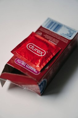 A vertical shot of red Durex brand condoms in a box