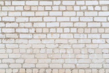 A closeup of an old white brick wall background