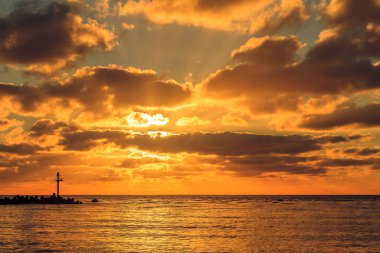 A beautiful cloudy sunset at the gates to the port of Klaipeda, Lithuania