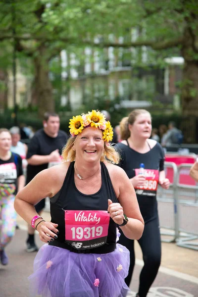 Vertical Shot Female Runner Purple Tutu Sunflower Headband Vitality London — Zdjęcie stockowe