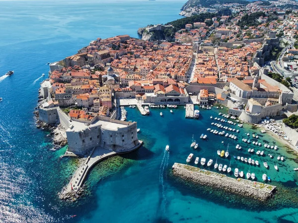 An aerial view of buildings and a castle by the Adriatic sea in Dubrovnik, Croatia