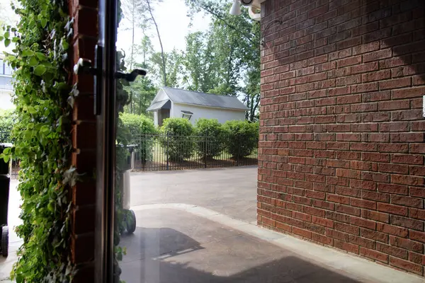 Alley Brick Wall Yard Green Bushes Window — 스톡 사진