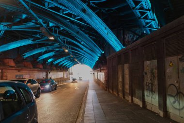 blue illuminated underpass in the center of cologne with the street name trankgasse under the main train station