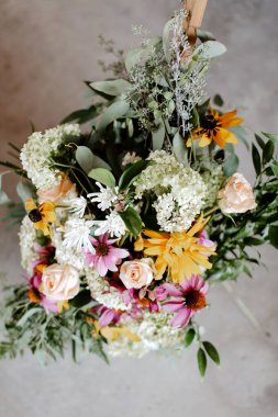 A vertical shot of a wedding bouquet
