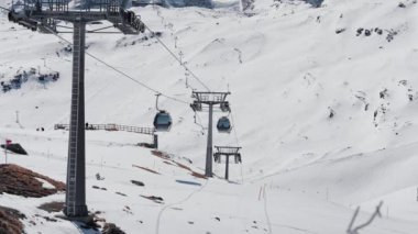A scenic view of Zermatt Switzerland Gondolas in mountains covered in snow during the winter season