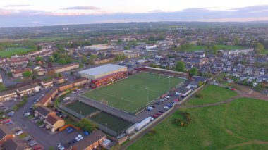 An aerial view of Stenhousemuir football club stadium at sunset in Scotland