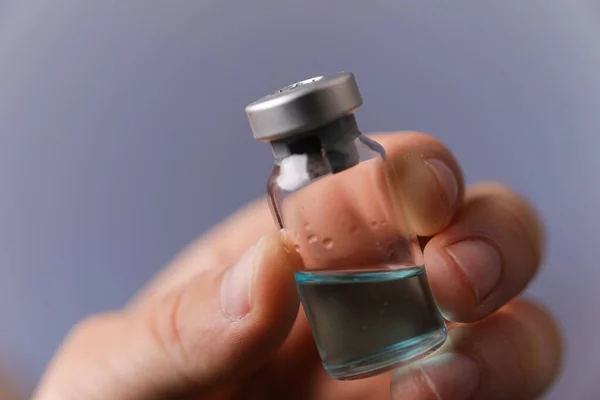 Close Shot Fingers Holding Vaccine Jar — Stockfoto
