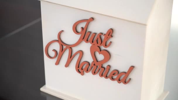 Closeup White Pedestal Just Married Red Inscription — Stockvideo