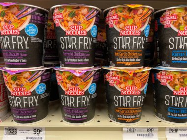 Augusta, Ga USA - 12 20 21: Stir fry cup noodles and shelf price tag