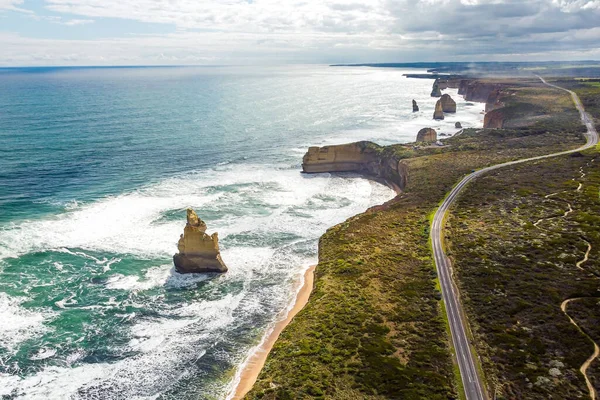 Aerial view of the 12 Apostles and Great Ocean Road, Victoria on a sunny day with clouds