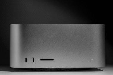 Straight frontal view of contrasting low key still life of new desktop computer system