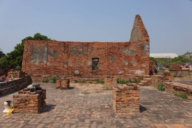 A beautiful shot of a sacred red brick building in Thailand.