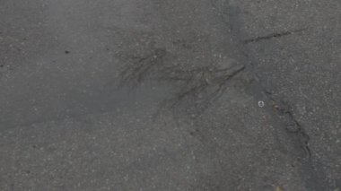 An HD of the rain dropping on the floor