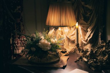 A beautiful interior shot of candles, books and lights on a table in Asheville, North Carolina during the Christmas Holidays