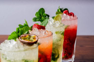 A selective focus shot of four glasses with refreshing cocktails