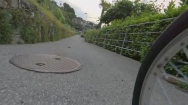 A bike-riding street wheel slow motion, rural, neighborhood