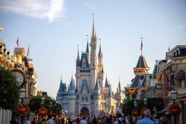 A beautiful exterior shot of Cinderella Castle at Disney World in the Morning with a blue sky in Orland, USA clipart