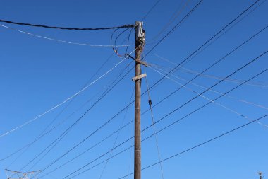 A low angle shot of an electric tower