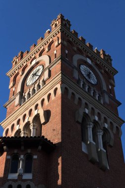 A low-angle shot of the clock tower of Usina del Arte cultural center in Argentina