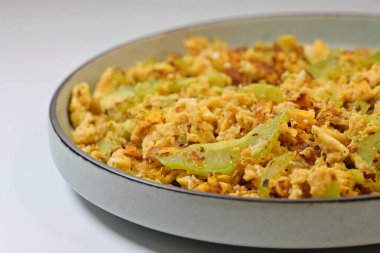 Bitter gourd or melon, Momordica charantia, is valued in Chinese cuisine for its flavour, typically in stir-fries, soups, dim sum & herbal teas.