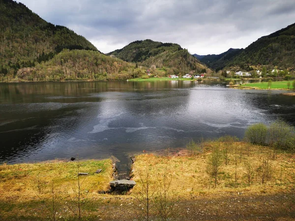 A beautiful view of a river surrounded by mountains
