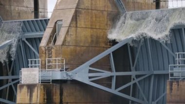 Water rushing over the edge of a overflowing Lewis and Clark Dam in Yankton, South Dako