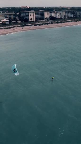 Vertical Aerial View Kitesurfer Ocean Town Background — Vídeo de stock