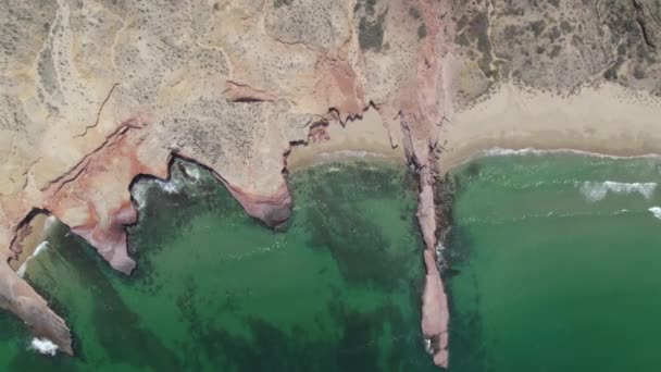 Aerial View Wavy Sea Hitting Sandy Beach Surrounded Rocky Mountains — Stock video