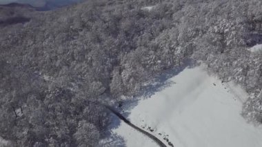An aerial view of the snowy mountain Monte Generoso in Ticino, Switzerland