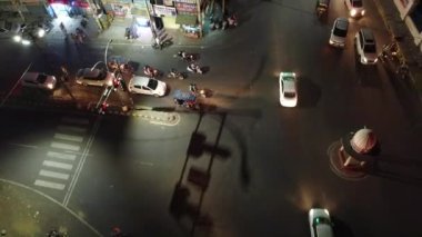 An aerial view of the hyperlapse of moving vehicles on street at night