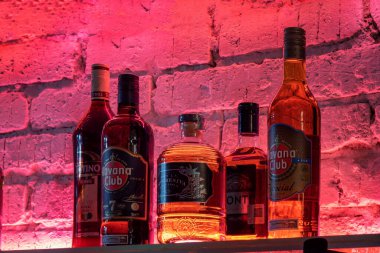 A closeup shot of Havana Club rum bottles in a bar