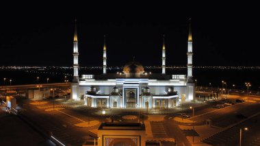 A night view of Al Ghanim Masjid with the lights at Sulaibikhat Cemetery