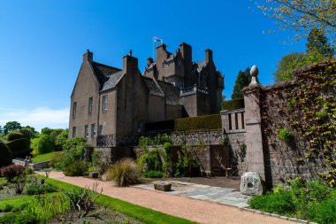 The Crathes Castle and its magical green garden in the daytime in Scotland, the UK