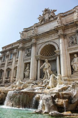 A beautiful view of the ancient Trevi Fountain on a sunny morning