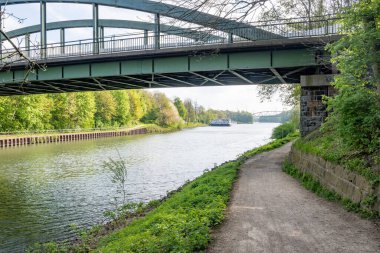 a shot of small river under bridge