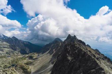 A beautiful view of mountains under the blue cloudy sky