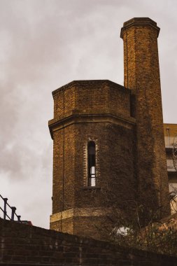 The hydraulic accumulator tower in London against a cloudy sky
