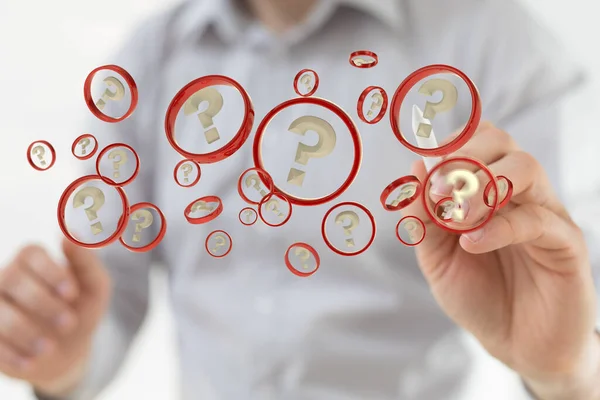 A man\'s hand with a pencil pointing at a 3D rendering of floating question icons in red circles