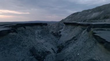 A top view of broken road on mountains