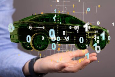 Bir elin yanında numaralar olan resimli bir araba.