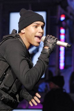 A vertical shot of Singer rapper Chris Brown performing live at the former Gibson Amphitheater in military uniform in Universal City, LA, California