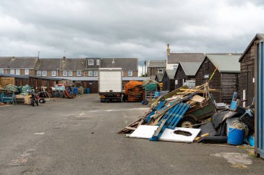 Sheds used for storage at the harbour in Amble, Northumberland, UK