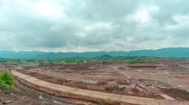 A time-lapse of clouds moving above a construction site