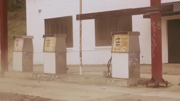 Slow Motion View Dust Swirling Abandoned Gas Station Pumps Asheville — стоковое видео